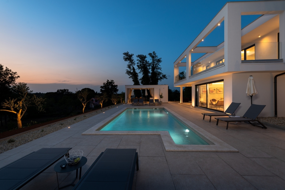 The pool of the Luxury Villa Sonia With Wellness & Gym ID 6729 at sunset