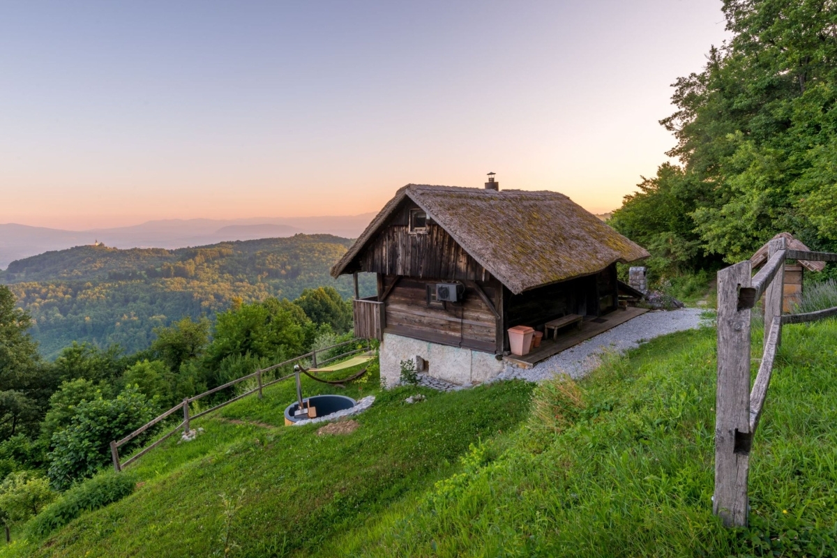 Wooden Vineyard cottage in the Slovenian countryside during sunset